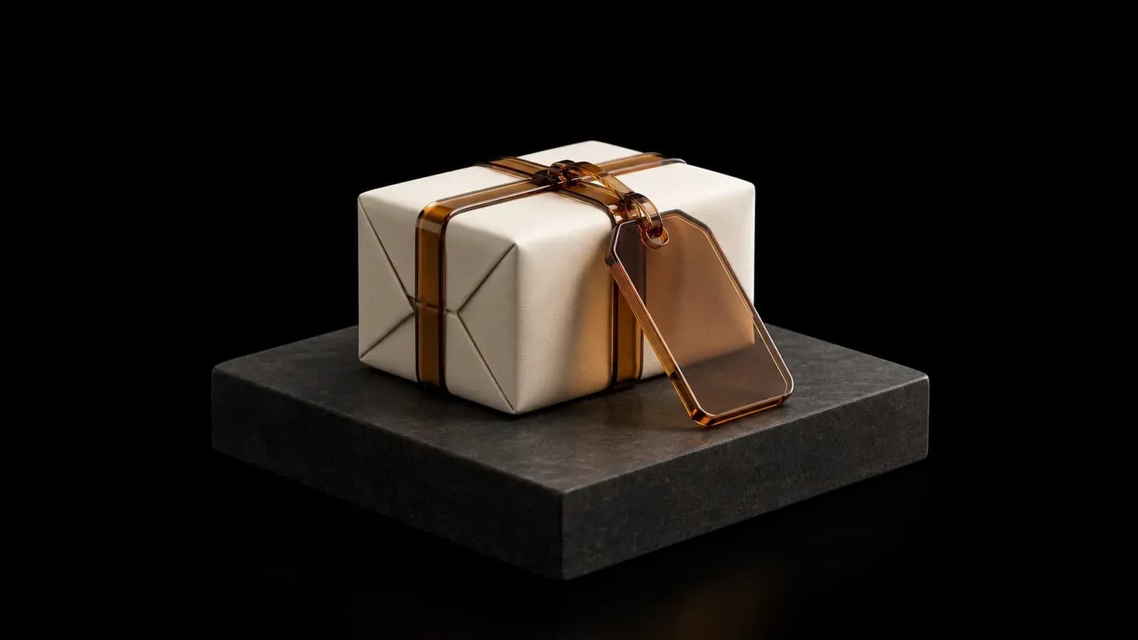 An ivory parcel with ribbon and a blank amber tag.